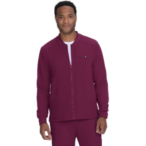A maroon jacket with a zipped front and a logo, worn by a smiling model.