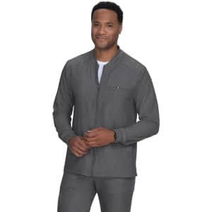 A man is wearing a grey jacket with a zip, featuring a pocket on the chest. The jacket has a simple design.