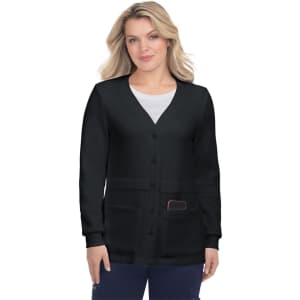 A woman wearing a black Clarissa sweater with a V-neck, buttons, and pockets. The sweater has a soft texture.