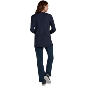 A navy Kori Sweater displayed from the back, paired with matching dark trousers and casual shoes.
