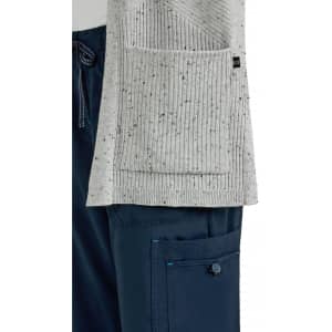 A grey Kori Sweater with a ribbed texture and a pocket, displayed alongside navy pants.