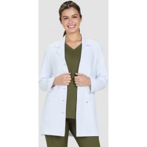 A white Hema lab coat is worn over a green top, featuring a fitted design and buttons at the front.