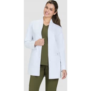A white lab coat worn over an olive green top, featuring a straight-cut design and an open front.