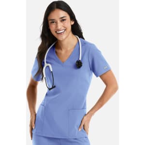 A female model wearing a light blue double v-neck top, paired with a stethoscope around her neck.