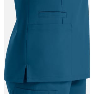 A side view of a teal women's double V-neck top featuring pockets and a sleek design.