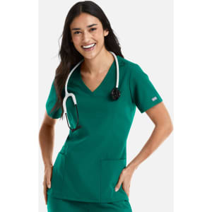 A woman wearing a green double V-neck top with stethoscope around her neck, featuring two front pockets.