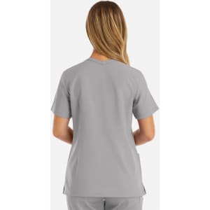 A women's double V-neck top in grey, featuring short sleeves and a relaxed fit, with a logo on the back.