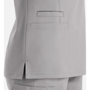 A grey double V-neck top featuring side slits and a patch pocket on the back. The garment has a subtle, sleek design.