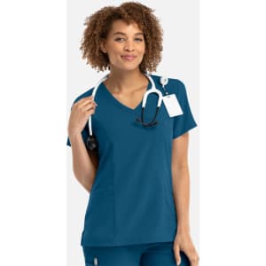 A women's mock wrap top in teal with a stethoscope around the neck and a logo on the chest.