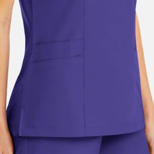 A purple women's mock wrap top with side pockets and a sleek, tailored design. The fabric appears smooth and lightweight.