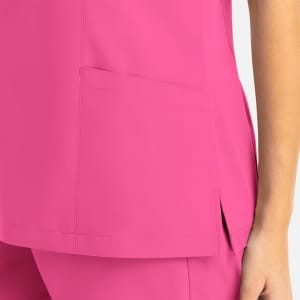 A pink women's mock wrap top featuring a side pocket and a stylish cut. The fabric appears smooth and lightweight.