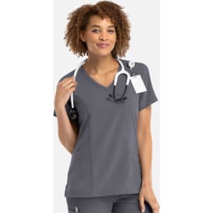 A women's mock wrap top in grey with a v-neck design, featuring a logo and a stethoscope.