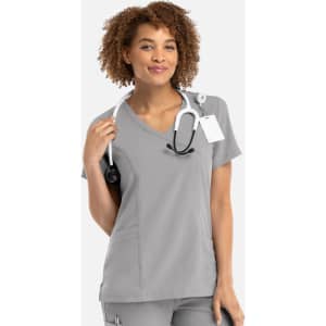 A women's grey mock wrap top with short sleeves and a stethoscope around the neck, featuring a logo.