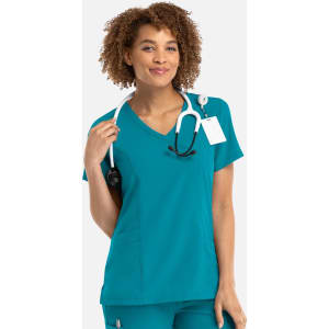 A teal women's mock wrap top, featuring a V-neck and a stethoscope, with a tag attached and a logo.