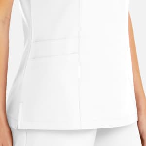 A white women's mock wrap top featuring pockets and a fitted design. The top has a logo on it.