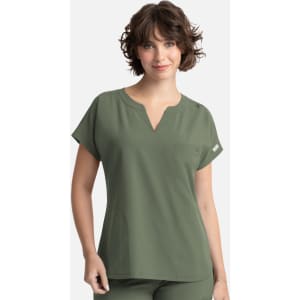 A women's olive green dolman top featuring a V-neck and three pockets, with a logo on the side.