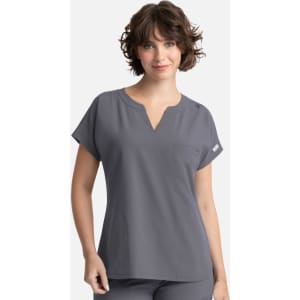 A grey women's dolman top featuring a V-neck and three pockets, with a small logo detail.