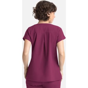 A women's dolman top in a rich plum colour, featuring a relaxed fit and short sleeves, with a back pleat detail.