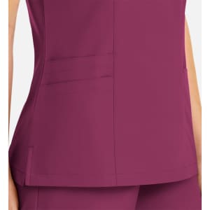 A purple women's mock wrap top with contrast trim and side pockets, featuring a sleek design.