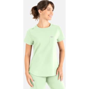 A light green round neck top designed for uniforms, featuring a pocket and decorative buttons. It includes a logo.