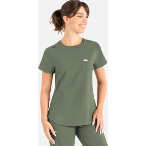 A green round neck scrub top with a pocket and a logo, worn by a smiling model.