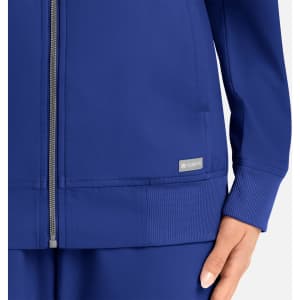 A women's full zip bomber jacket in vibrant blue with a subtle logo displayed on the fabric.