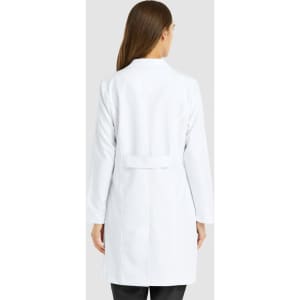 A white women's full-length lab coat with a back belt detail and long sleeves. It features a logo.
