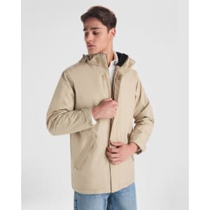 A beige parka jacket with a hood, featuring a front zip and side pockets, displayed on a model.