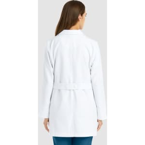 A mid-length women's lab coat in white, featuring a belt and a simple design, with a logo on the back.