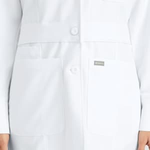 A white mid-length women's lab coat featuring two large pockets and a branded logo.