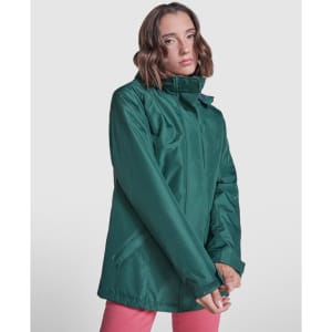 A green women's parka with a high collar, featuring a zip and side pockets, displayed on a model.
