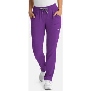 A pair of purple women's pants featuring a full elastic waistband and pockets, with a logo on the side.