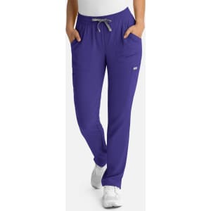 A pair of women's full elastic pull-on pants in purple with pockets and a drawstring waistband.