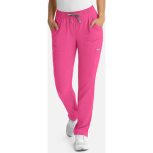A pair of pink full elastic pull-on pants for women with side pockets and a drawstring waistband.