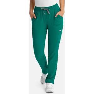 A pair of women's full elastic pull-on pants in teal, featuring side pockets and a drawstring waistband.