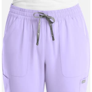 A pair of women's full elastic pull-on pants in light purple, featuring front pockets and a drawstring.