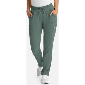 A pair of women's full elastic pull-on pants in a muted green colour, featuring pockets and a drawstring waist.