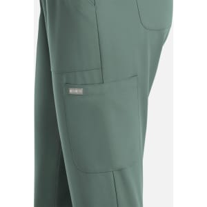 A pair of women's full elastic pull-on pants in a muted green colour, featuring side pockets and a logo.