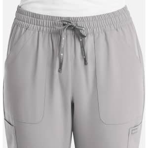 A pair of women's full elastic pull-on pants in light grey, featuring pockets and a drawstring waist.