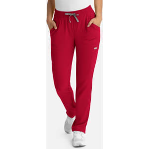 A women's full elastic pull-on pant in vibrant red, featuring pockets and a drawstring waist.