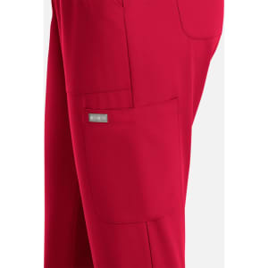 A pair of women's full elastic pull-on pants in bright red, featuring a side pocket and a branding logo.