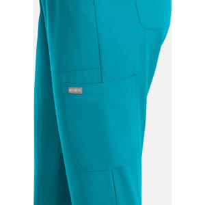 A pair of women's pants in teal with a side pocket and a logo. Full elastic pull-on style.