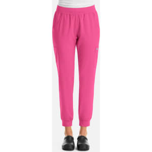 A pair of pink women's joggers with an elastic waistband and side pockets, featuring a logo on the leg.