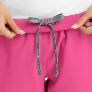 A pair of pink women's joggers with a grey drawstring at the waist and a logo present.