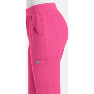 A pair of women's jogger pants in bright pink with an elastic waistband and side pockets, featuring a small logo.