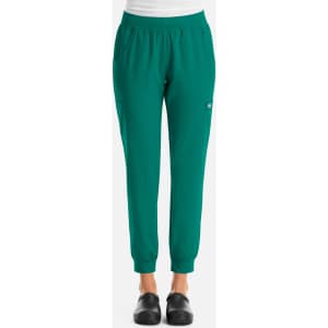 A pair of women's jogger pants in green, featuring a logo and an elastic waistband for comfort.