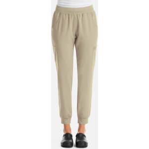 A pair of women's joggers in a light beige colour, featuring an elastic waistband and pockets.