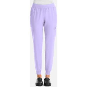 A pair of lavender jogger pants with an elastic waistband and side pockets, featuring a logo.