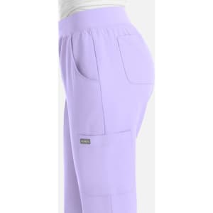 A pair of light lavender women's joggers with side pockets and an elastic waistband. The pants have a logo.