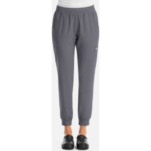 A pair of women's joggers in a grey colour, featuring an elastic waistband and side pockets. The joggers have a logo.